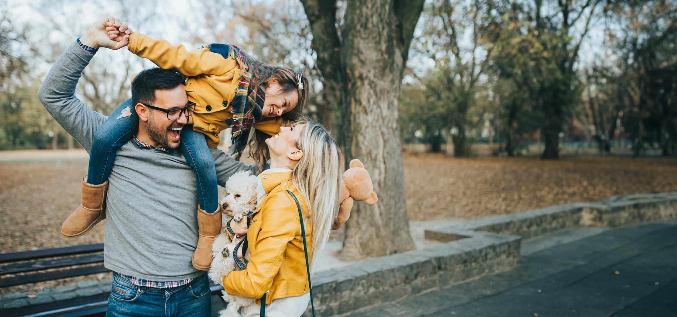 Family and dog being silly outside